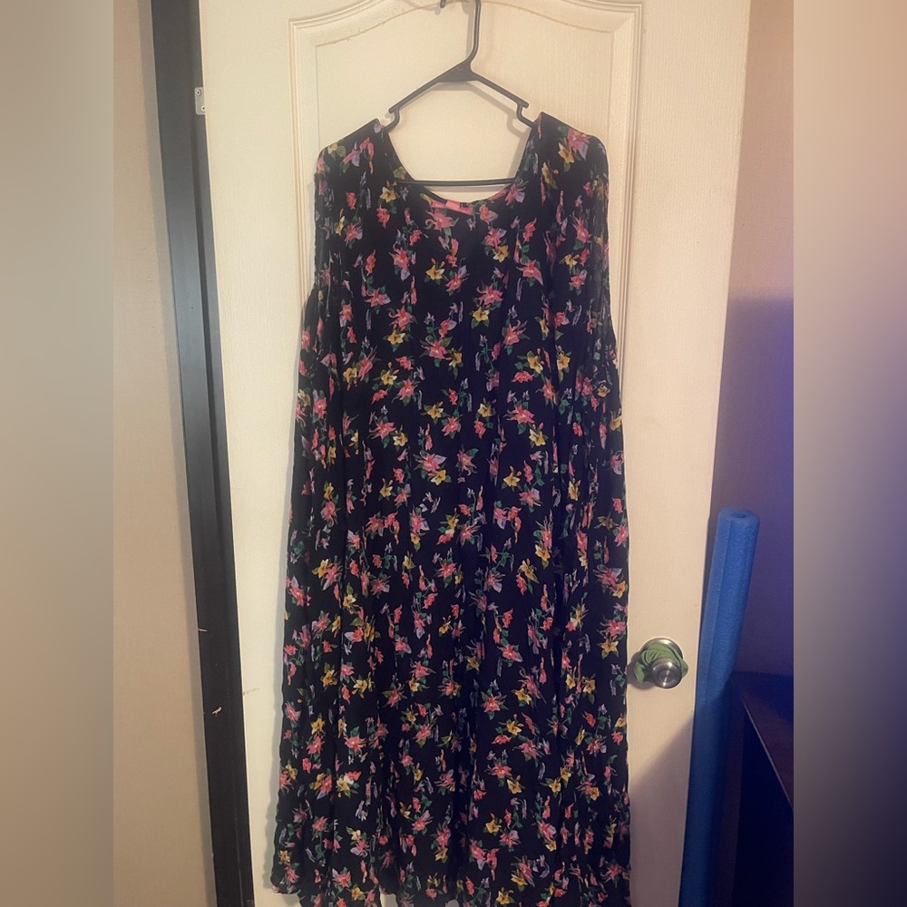 Woman Within Floral Dress with Pink and Purple Accents